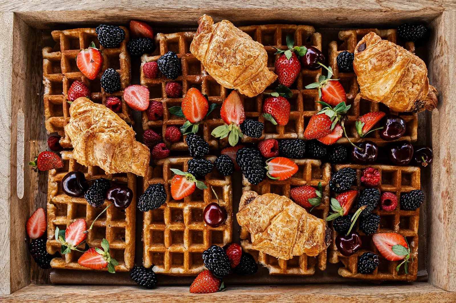 Waffles and croissants with berries