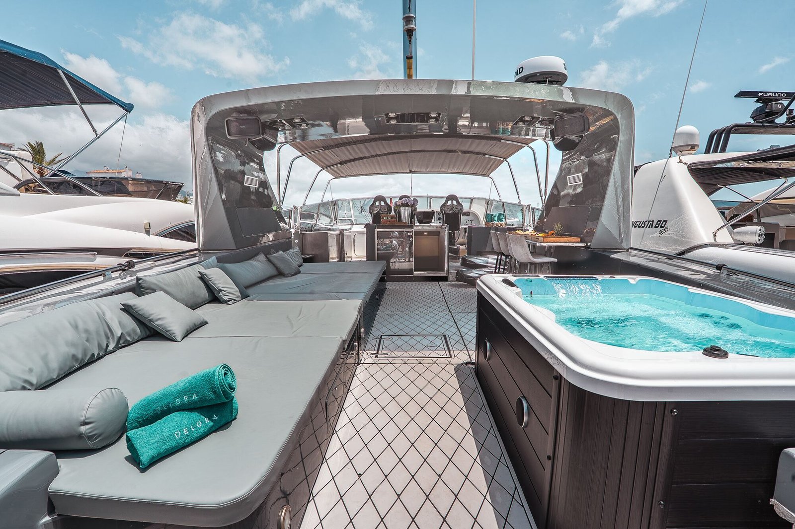 Sun deck and jacuzzi aboard Happy Hour yacht Marbella