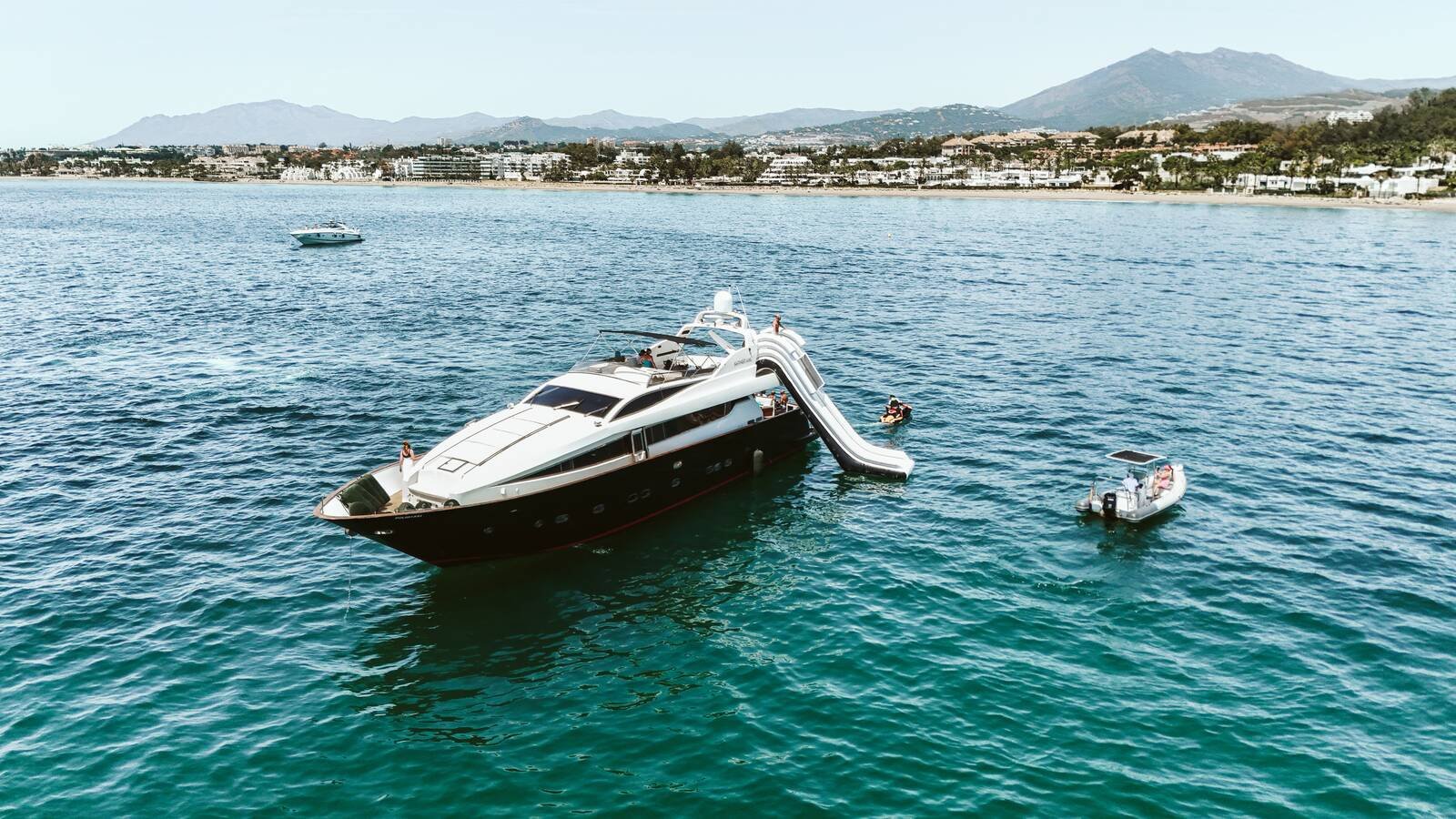 Venus Antago 90 yacht charter Marbella at anchor with slide